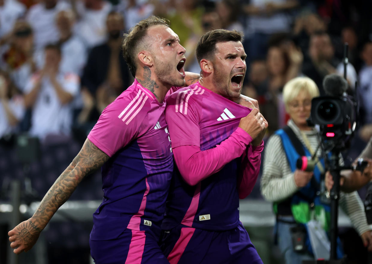 MOENCHENGLADBACH, GERMANY - JUNE 07: Pascal Gross of Germany celebrates scoring his team's second goal with teammate David Raum during the international friendly match between Germany and Greece at Borussia Park Stadium on June 07, 2024 in Moenchengladbach, Germany. (Photo by Alex Grimm/Getty Images)