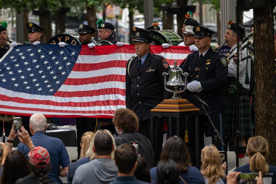 Firefighters and members of the police take part in the ceremony at the 9/11 Memorial and Museum at the Ground Zero site in lower Manhattan during commemoration ceremonies for the 22nd anniversary of the attacks on Sept. 11 in New York City.