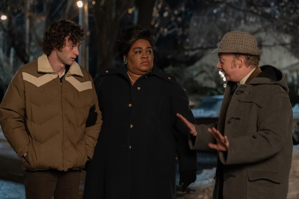 Angus (Dominic Sessa, left), Mary (Da'Vine Joy Randolph) and Paul (Paul Giamatti) leave a holiday party that takes an emotional, whiskey-fueled turn in "The Holdovers."