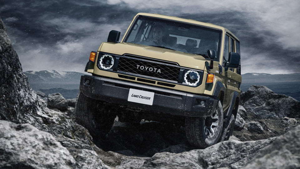 The 2024 Toyota Land Cruiser 70 driving over rocks