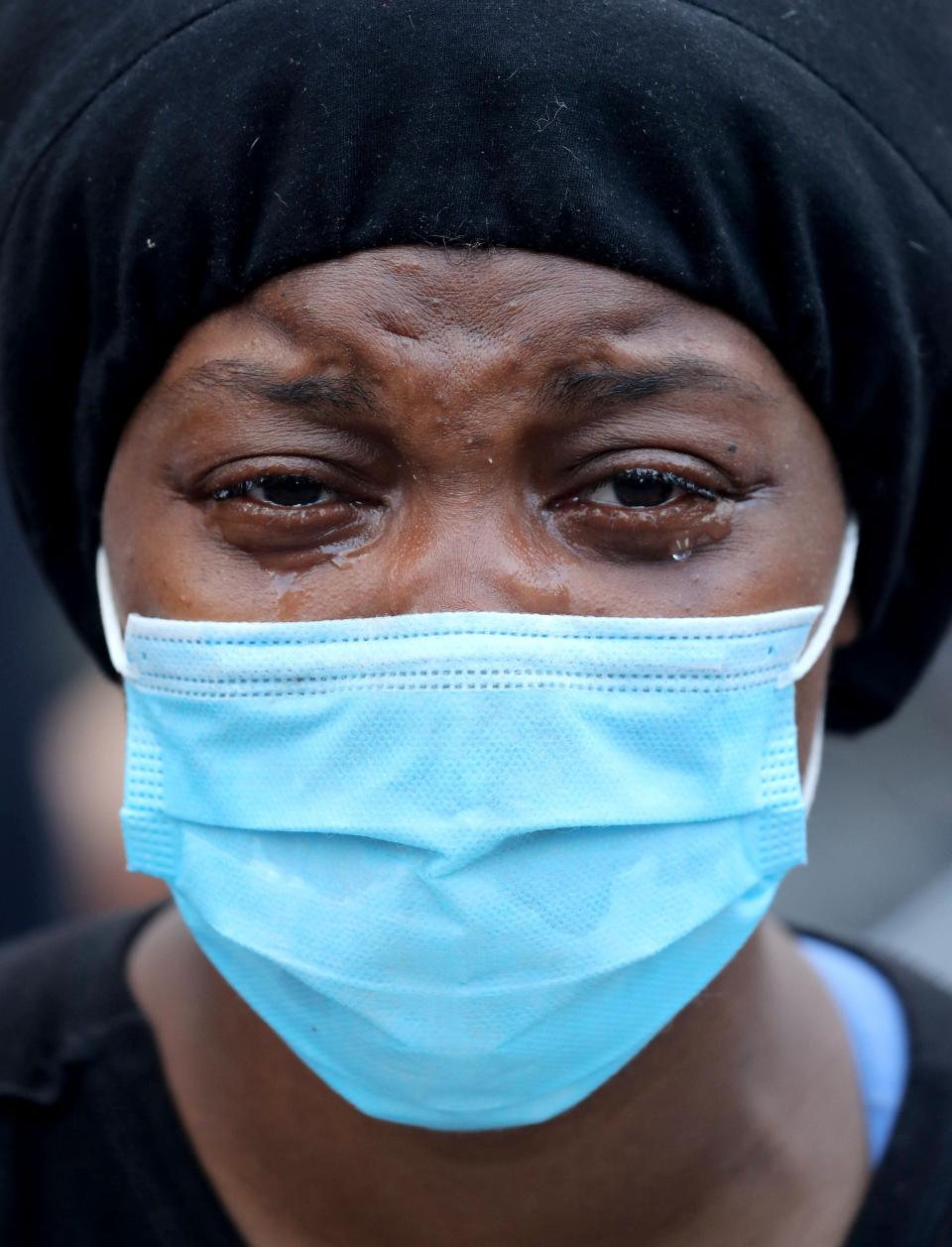 A woman cries as she joins protesters at Union Square in Manhattan on Saturday.