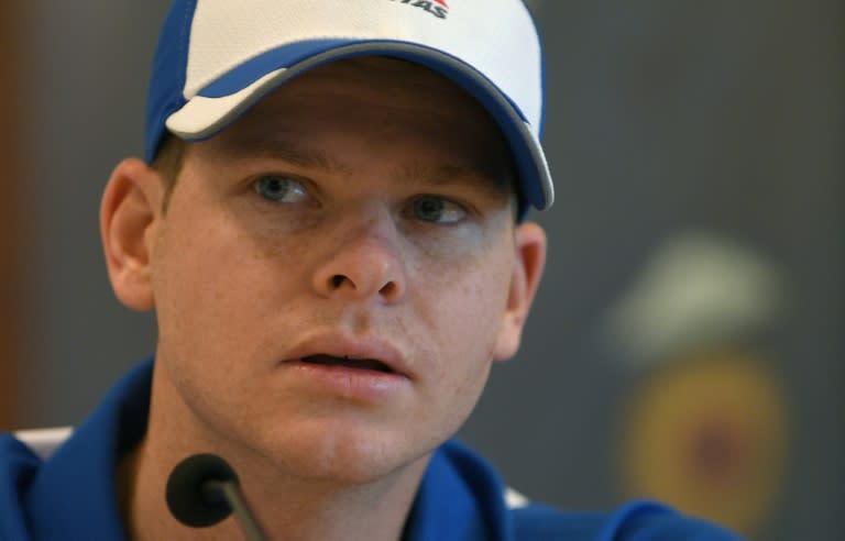 Australia's Test cricket captain Steven Smith look on during a press conference in Mumbai on February 14, 2017