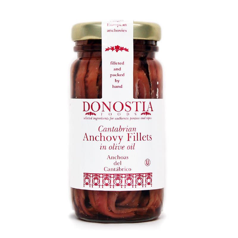 <p><a href="https://www.donostiafoods.com/products/anchovies?variant=247565592&currency=USD&gclid=Cj0KCQiApKagBhC1ARIsAFc7Mc4j8F_XL70w_vzgtaryF-AcoZDsNDjQM6f7p5BOx8D39KFBgEdj39AaAsMHEALw_wcB" rel="nofollow noopener" target="_blank" data-ylk="slk:Shop Now;elm:context_link;itc:0;sec:content-canvas" class="link rapid-noclick-resp">Shop Now</a></p><p>Cantabrian Anchovies in Olive Oil</p><p>donostiafoods.com</p>