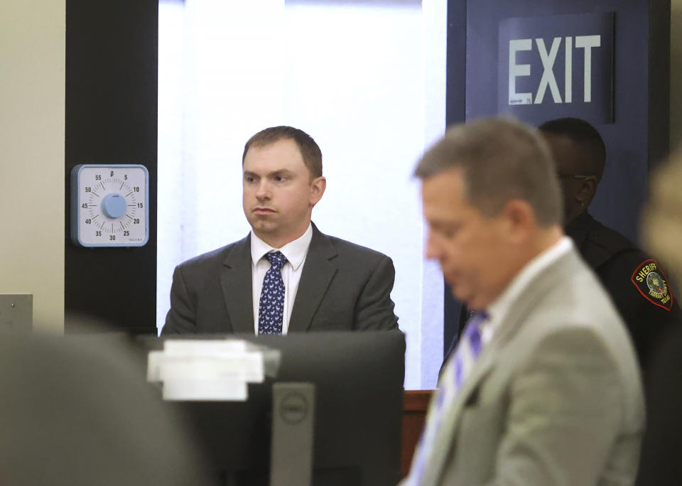 Aaron Dean enters Tarrant County's 396th District Court after a recess on Friday, Dec. 16, 2022, in Fort Worth, Texas. Dean, a former Fort Worth police officer, was found guilty of manslaughter in the 2019 shooting death of Atatiana Jefferson. (Amanda McCoy/Star-Telegram via AP, Pool)