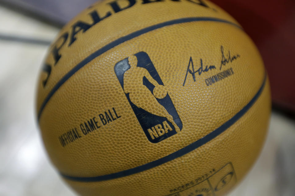 FILE - An NBA game ball featuring the signature of new NBA Commissioner Adam Silver is shown before a basketball game between the Indiana Pacers and the Brooklyn Nets in Indianapolis, Saturday, Feb. 1, 2014. Jerry West, who was selected to the Basketball Hall of Fame three times in a storied career as a player and executive and whose silhouette is considered to be the basis of the NBA logo, died Wednesday morning, June 12, 2024, the Los Angeles Clippers announced. He was 86. (AP Photo/Michael Conroy)