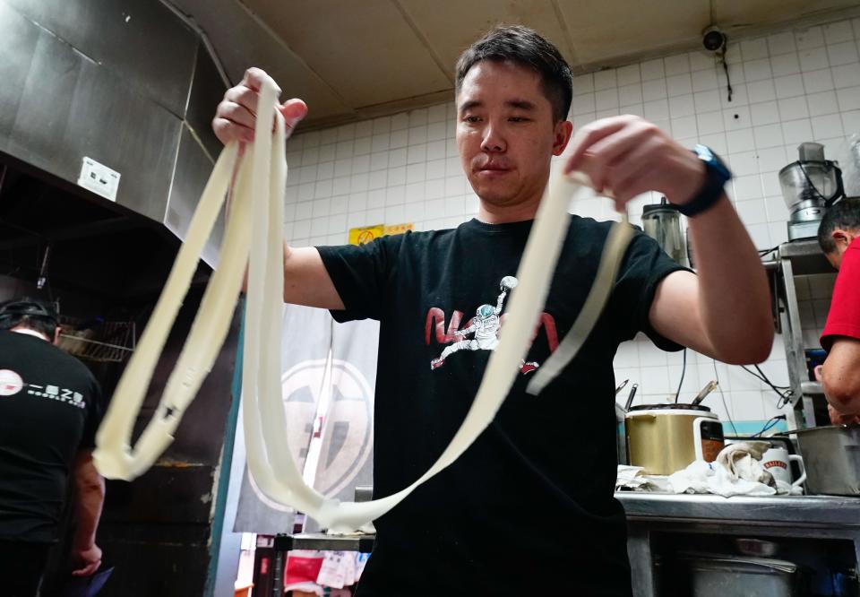 Steven Zhang hand pulls noodles at his restaurant Noodle Art in Monterey Park, Calif. Jan. 23, 2023. Monterey Park’s Asian cuisine is a big attraction.