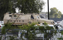 <p>A Pearland Police armored vehicle stands ready in front of Santa Fe High School in Santa Fe, Texas, in response to a shooting on Friday morning, May 18, 2018. (Photo: Kevin M. Cox/The Galveston County Daily News via AP) </p>