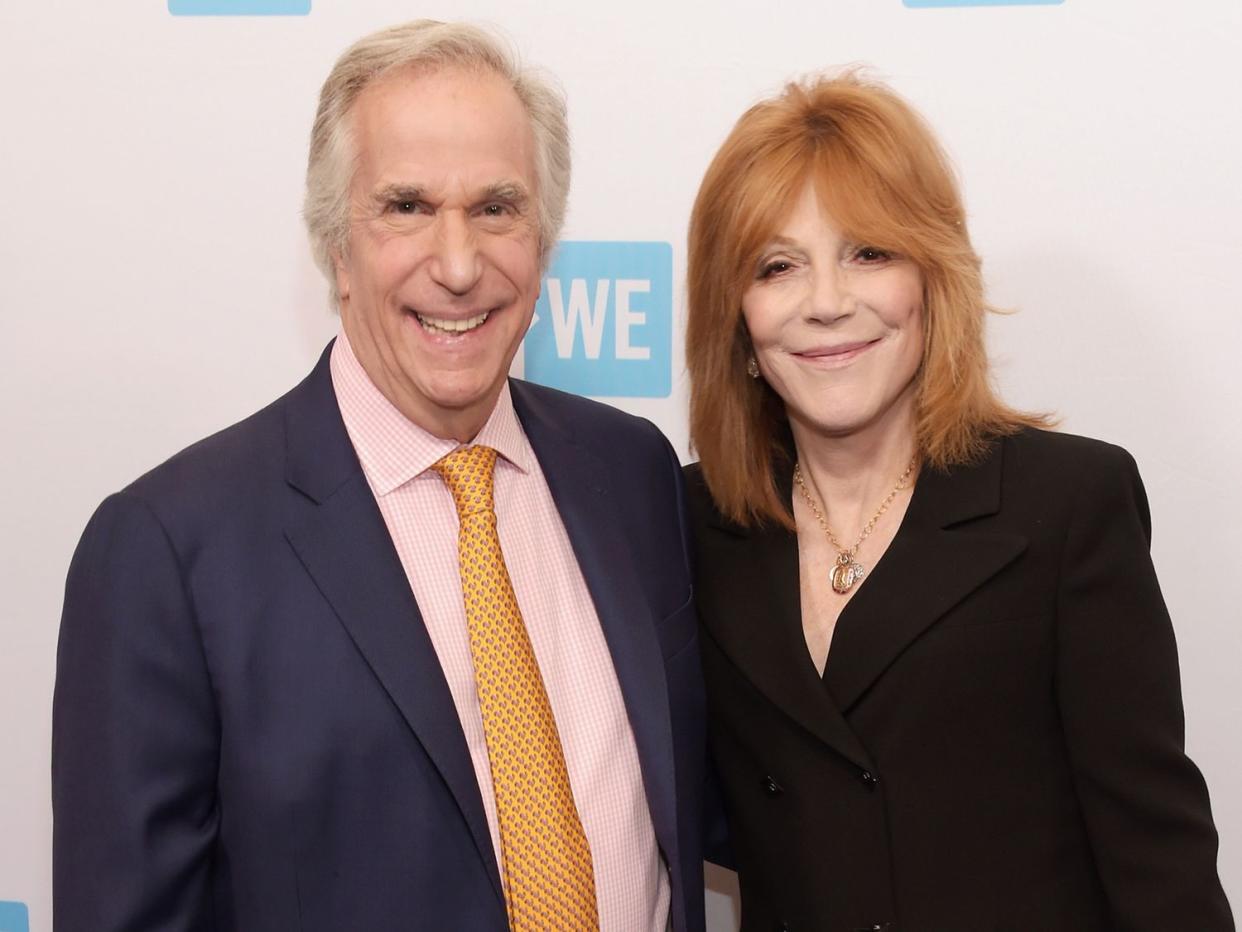 Henry Winkler (L) and Stacey Weitzman attend the WE Day Celebration Dinner at The Beverly Hilton Hotel on April 6, 2016 in Beverly Hills, California