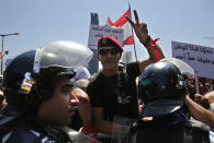 A Lebanese retired soldier protests near the parliament building where lawmakers and ministers are discussing the draft 2019 state budget, in Beirut, Lebanon, Tuesday, July 16, 2019. The lawmakers have begun discussing the budget amid tight security and limited protests against proposed austerity measures. The proposed budget aims to avert a financial crisis by raising taxes and cutting public spending in an effort to reduce a ballooning deficit. (AP Photo/Hussein Malla)