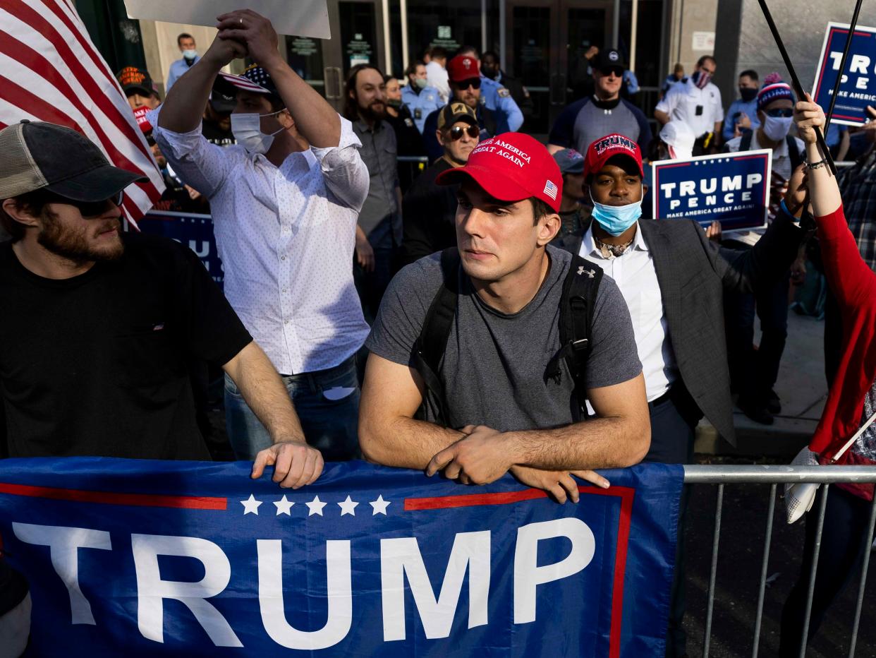Trump supporters react as people celebrate after major news organizations called the US 2020 presidential election for Joe Biden, defeating incumbent US President Donald Trump outside the Pennsylvania Convention Centre in Philadelphia, Pennsylvania, 7 November 2020 ((EPA))