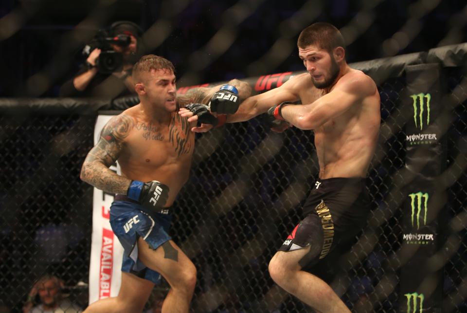 ABU DHABI, UNITED ARAB EMIRATES - SEPTEMBER 06: Khabib Nurmagomedov (red) in action against Dustin Poirier (blue) during UFC Lightweight Championship match at Yas Island in Abu Dhabi, United Arab Emirates on September 6, 2019.  (Photo by Stringer/Anadolu Agency via Getty Images)