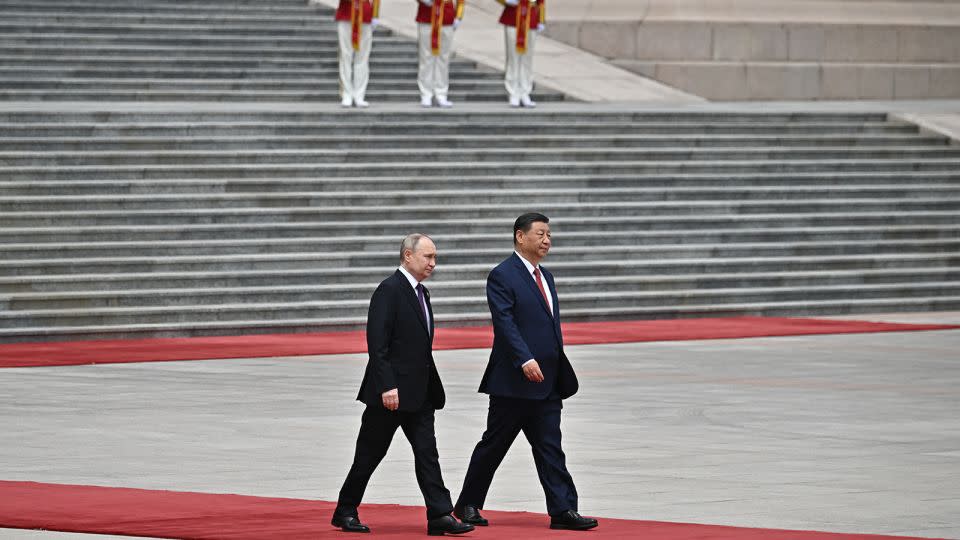 Russia's President Vladimir Putin and China's President Xi Jinping attend an official welcoming ceremony in front of the Great Hall of the People in Tiananmen Square in Beijing on May 16, 2024. - Sergei Bobylov/Pool/Sputnik/AFP/Getty Images