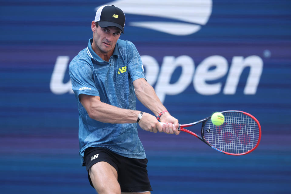 NEW YORK, NEW YORK – AUGUST 31: Tommy Paul of the United States hits a return against Gabriel Diallo of Canada during their men's singles third round match on day six of the 2024 US Open at the USTA Billie Jean King National Tennis Center on August 31, 2024 in the Flushing neighborhood of the Queens borough of New York City. (Photo by Matthew Stockman/Getty Images)