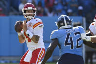 Kansas City Chiefs quarterback Chad Henne (4) passes as he is pressured by Tennessee Titans linebacker Joe Jones (42) in the second half of an NFL football game Sunday, Oct. 24, 2021, in Nashville, Tenn. (AP Photo/Mark Zaleski)