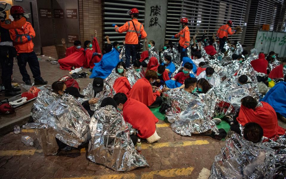 Anti-government protesters wait to be seen by medics at Hong Kong Polytechnic University - Getty Images AsiaPac