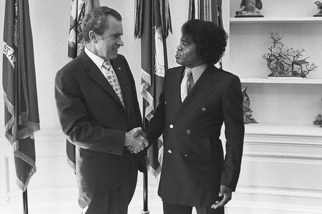 <p>Oliver F Adkins/PhotoQuest/Getty </p> President Richard Nixon and James Brown in October 1972