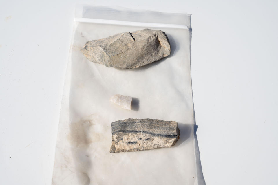 This photo provided by the U.S. Air Force shows fragments found at the Paleo-Archaic site recovered by members of the 49th Civil Engineer Squadron environmental flight at Holloman Air Force Base, N.M., March 7, 2024. (Airman 1st Class Isaiah Pedrazzini/U.S. Air Force via AP)