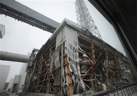 A general view of a building of Tokyo Electric Power Company's (TEPCO) tsunami-crippled Fukushima Daiichi nuclear power plant is seen from a bus during a media tour at the plant in Fukushima prefecture in this June 12, 2013 file photo. REUTERS/Noboru Hashimoto/Pool/Files