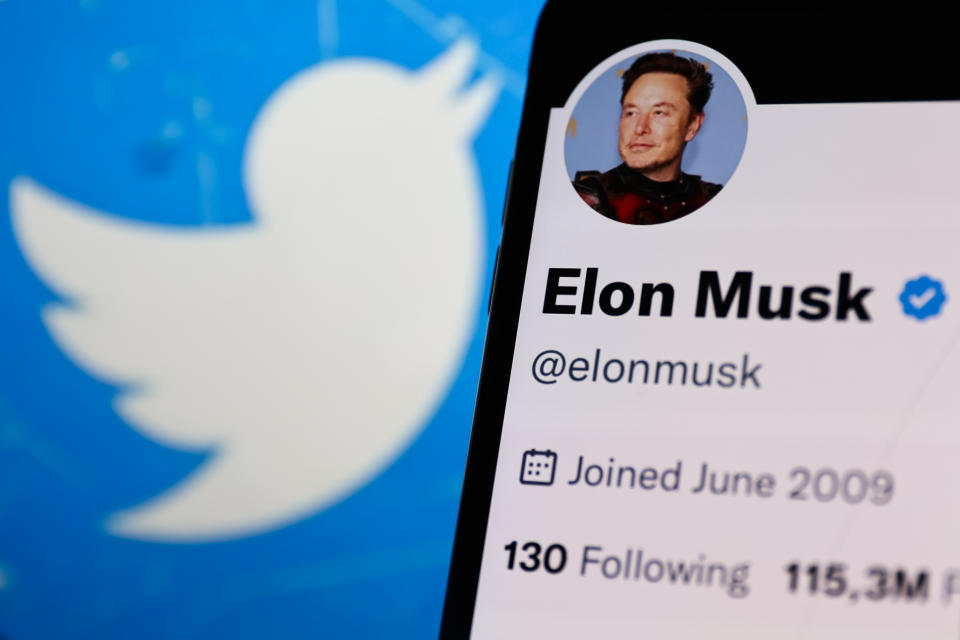 Elon Musk account on Twitter displayed on a phone screen and Twitter logo displayed on a laptop screen are seen in this illustration photo taken in Krakow, Poland on November 14, 2022. (Photo by Jakub Porzycki/NurPhoto via Getty Images)