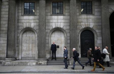 A man smokes a cigarette outside The London Stock Exchange November 11, 2013. REUTERS/Eddie Keogh