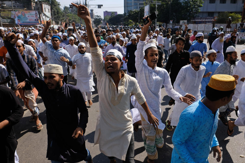 Muslim devotees shout slogans during a protest over an alleged insult to Islam, after Friday prayers outside the country’s main Baitul Mukarram Mosque in Dhaka, Bangladesh, Friday, Oct. 15, 2021. Friday’s chaos in Dhaka followed reported incidents of vandalism of Hindu temples in parts of the Muslim-majority Bangladesh after photographs of a copy of the Holy book Quran at the feet of of a Hindu Goddess went viral on social media in a temple at Cumilla district in eastern Bangladesh. (AP Photo/Mahmud Hossain Opu, File)