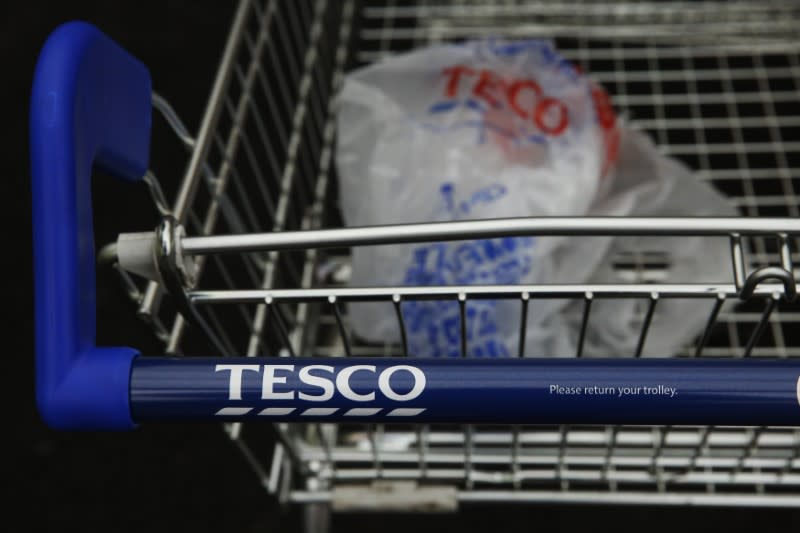 A discarded carrier bag is seen in a shopping trolley outside a Tesco supermarket in London January 5, 2015. REUTERS/Luke MacGregor