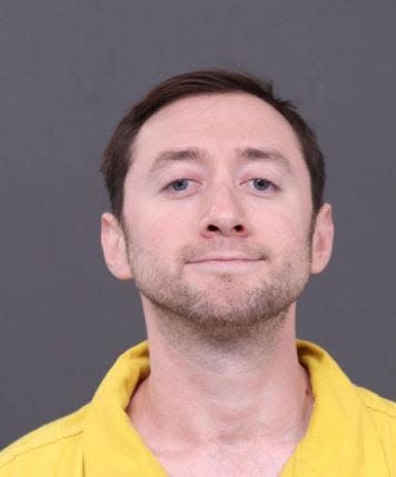 Photo provided by the Bucks County District Attorney’s Office shows Justin Mohn, 32, following his arrest in connection with the death of his father on Tuesday, Jan. 30, 2024. Pennsylvania police say Mohn decapitated his father and showed the head in a video uploaded to YouTube.