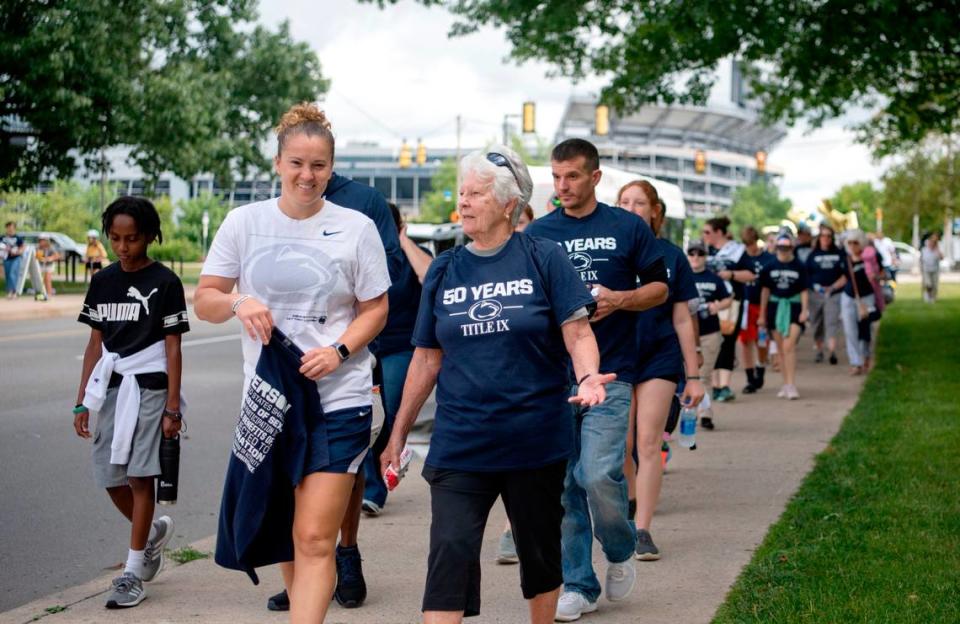 Penn State Lady Lions coach Carolyn Kieger walks in the “Roar and Rally” walk through campus celebrate the 50th Anniversary of Title IX on Thursday, June 23, 2022.