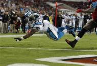 Oct 24, 2013; Tampa, FL, USA; Carolina Panthers fullback Mike Tolbert (35) jumps into the end zone to score a touchdown during the second half against the Tampa Bay Buccaneers at Raymond James Stadium. Kim Klement-USA TODAY Sports