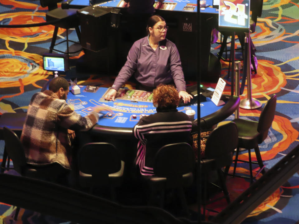 A dealer conducts a card game at the Ocean Casino Resort in Atlantic City, N.J., Dec. 2, 2022. Figures released April 10, 2023, by New Jersey gambling regulators show the city's nine casinos collectively posted a gross operating profit of $731 million in 2022, down 4.6% from the previous year. (AP Photo/Wayne Parry)