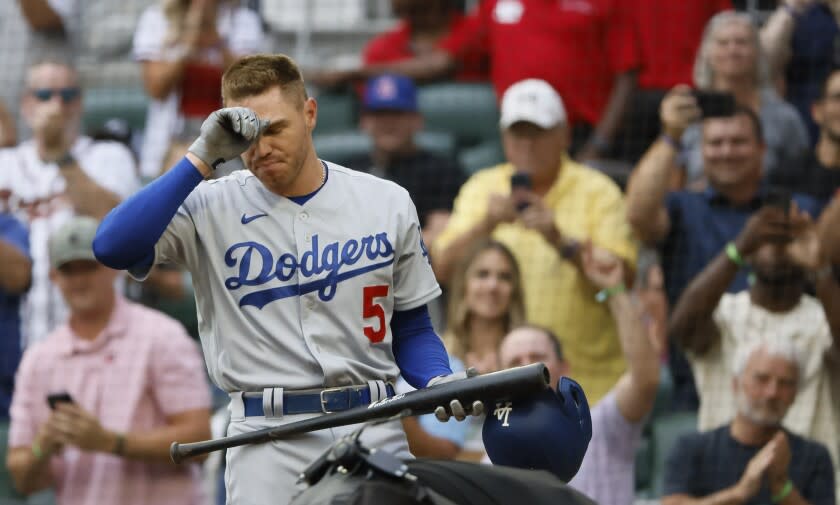 Los Angeles Dodgers' Freddie Freeman reacts to a standing ovation.