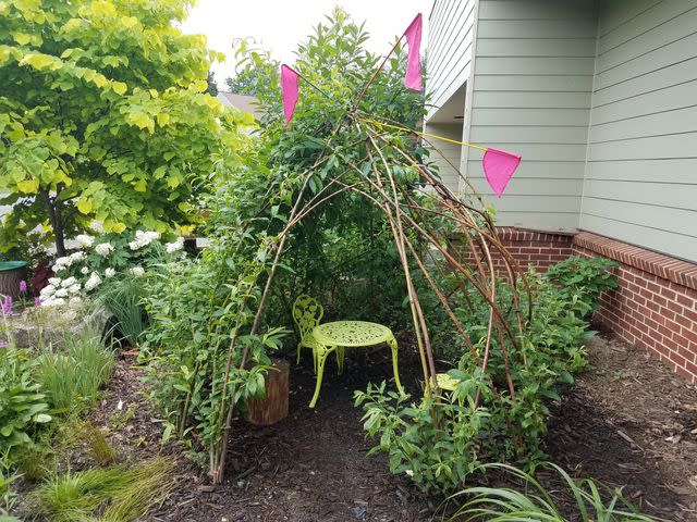 Justin Smith / Getty Images A den made of sticks can serve as a fort as well as a structure to grow beans or other vines