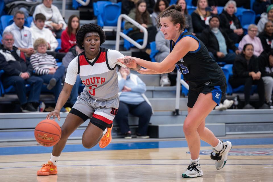 South's Naima Bleou drives as Leominster's Kyra Forsberg defends.