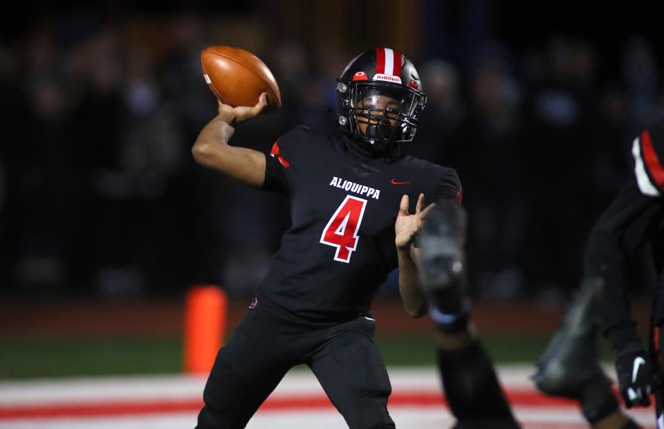 Aliquippa's Quentin Goode throws downfield during the first half against Central Valley Friday night at Jimbo Covert Field in Freedom, PA.