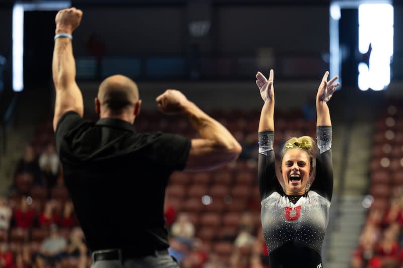 Utah's Camie Winger celebrates with a coach after her vault during the Sprouts Farmers Market Collegiate Quads at Maverik Center in West Valley on Saturday, Jan. 13, 2024. | Megan Nielsen, Deseret News