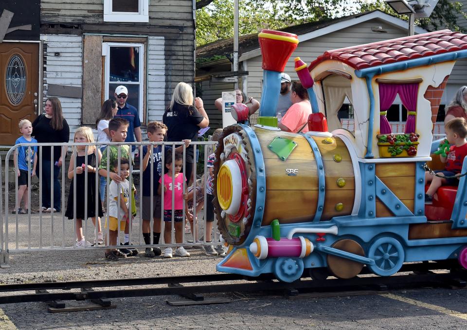 Kids wait their turn as a train ride pulls in to the station on Aug. 18, 2022, at the 75th annual Pataskala Street Fair supporting West Licking Firefighters Association. The 2023 fair runs from Aug. 16-19 on Main Street in Pataskala.