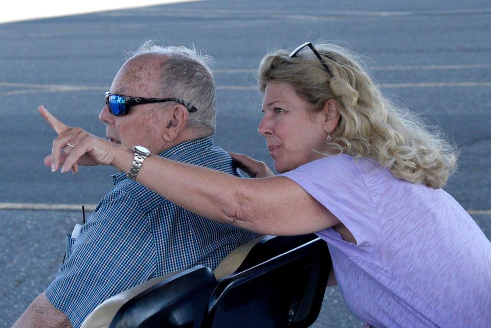 Elizabeth Harte points out the TBM Avenger Torpedo Bomber, to her father Robert Doane at Monmouth Executive Airport on Saturday, July 22, 2023 in Wall, New Jersey.