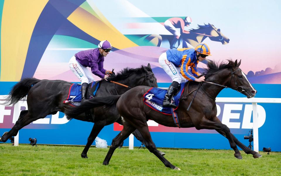 Ryan Moore riding Auguste Rodin in action on their way to winning the Betfred Derby - Reuters/Peter Cziborra