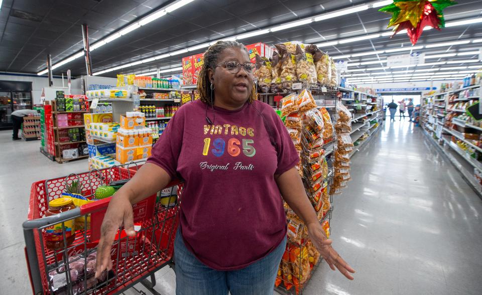 Verna Gibbs of Cary, Miss., a water and wastewater operator for Cary who is in Rolling Fork helping with water restoration and leak repair after the Friday night tornado hit the town, takes a few moments to grab groceries for her family. "We're trying to get some things to keep us going," Gibbs said, Tuesday. The store, Stop-N-Shop, is using a generator to stay open.