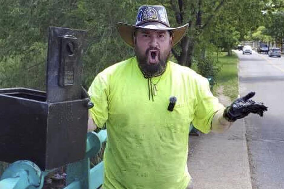 In this still image from video, Magnet fisher James Kane exclaims as he reacts to the contents of a safe he pulled out of a pond, in Flushing Meadows Corona Park, in the Queens borough of New York, Friday May 31, 2024. Kane, 40. and his girlfriend, Barbi Agostini, 39, estimate the safe contained $100,000 in waterlogged, damaged but exchangeable currency. (James Kane and BarbI Agostini @LetsGetMagnetic via AP)