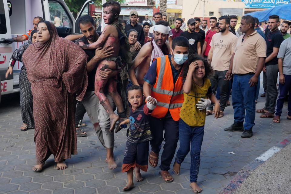 Wounded Palestinians are brought to a hospital in Deir al Balah, Gaza Strip, on Oct. 31, 2023.