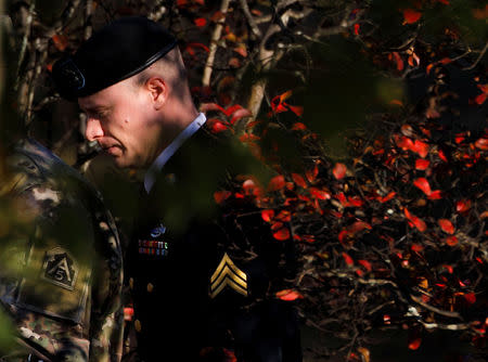 U.S. Army Sergeant Bowe Bergdahl is framed by foliage as he arrives for a second appearance of the day during sentencing proceedings in his court martial at Fort Bragg, North Carolina, U.S., November 2, 2017. REUTERS/Jonathan Drake