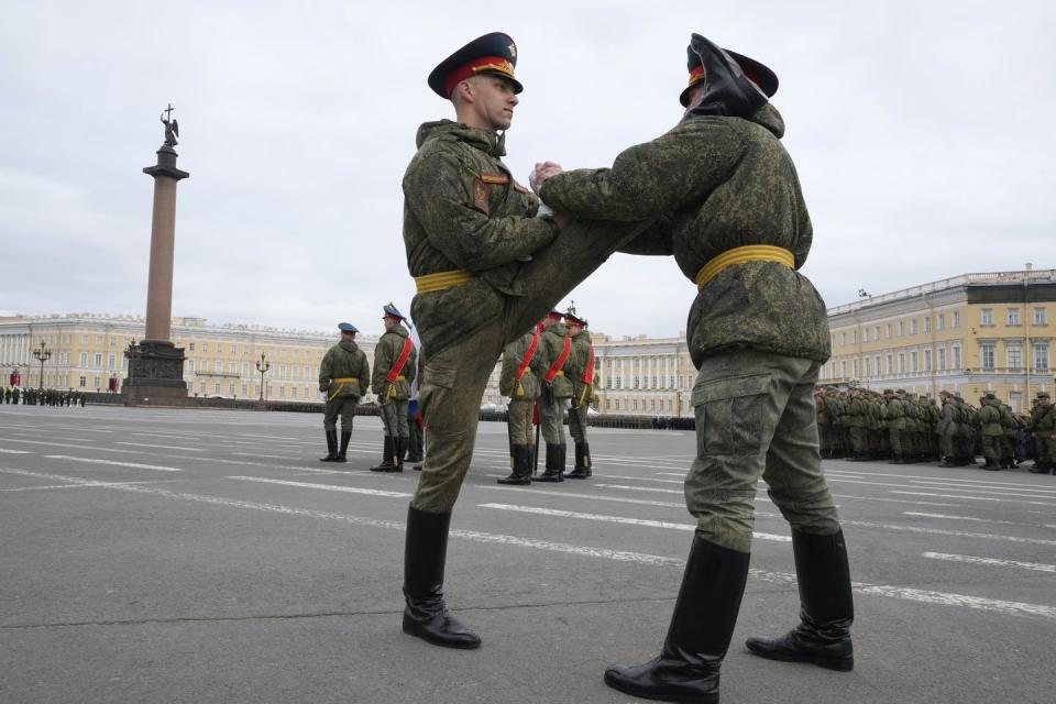 <span class="caption">Honor guard soldiers warm up prior to a May 5 rehearsal for the Victory Day military parade that will be held May 9, 2022, in St. Petersburg, Russia, to mark 77 years since the victory in World War II.</span> <span class="attribution"><a class="link " href="https://newsroom.ap.org/detail/Russia%20Parade%20Rehearsal/df359849120940dd84edcf0158fbd838?Query=victory%20day%20parade%20russia&mediaType=photo&sortBy=arrivaldatetime:desc&dateRange=Anytime&totalCount=2082&currentItemNo=6" rel="nofollow noopener" target="_blank" data-ylk="slk:AP Photo/Dmitri Lovetsky;elm:context_link;itc:0;sec:content-canvas">AP Photo/Dmitri Lovetsky</a></span>