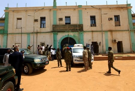 Security forces prepare to escort Sudan's ex-president al-Bashir from the National Prison in Khartoum