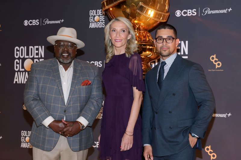 Left to right, Cedric the Entertainer, Helen Hoehne and Wilmer Valderrama attend the 81st annual Golden Globe Award nominations announcement event in Beverly Hills, Calif., on Monday. Photo by Greg Grudt/UPI