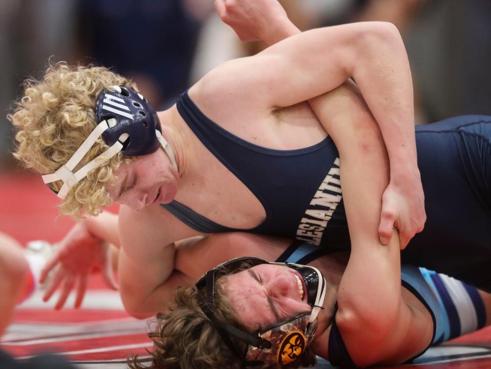 Salesianum's Leo Marini (top) moves toward a pin of Cape Henlopen's Cale Baker at 113 pounds in the DIAA Division I Dual Meet wrestling championship, Saturday Feb. 18, 2023 at Smyrna High School.