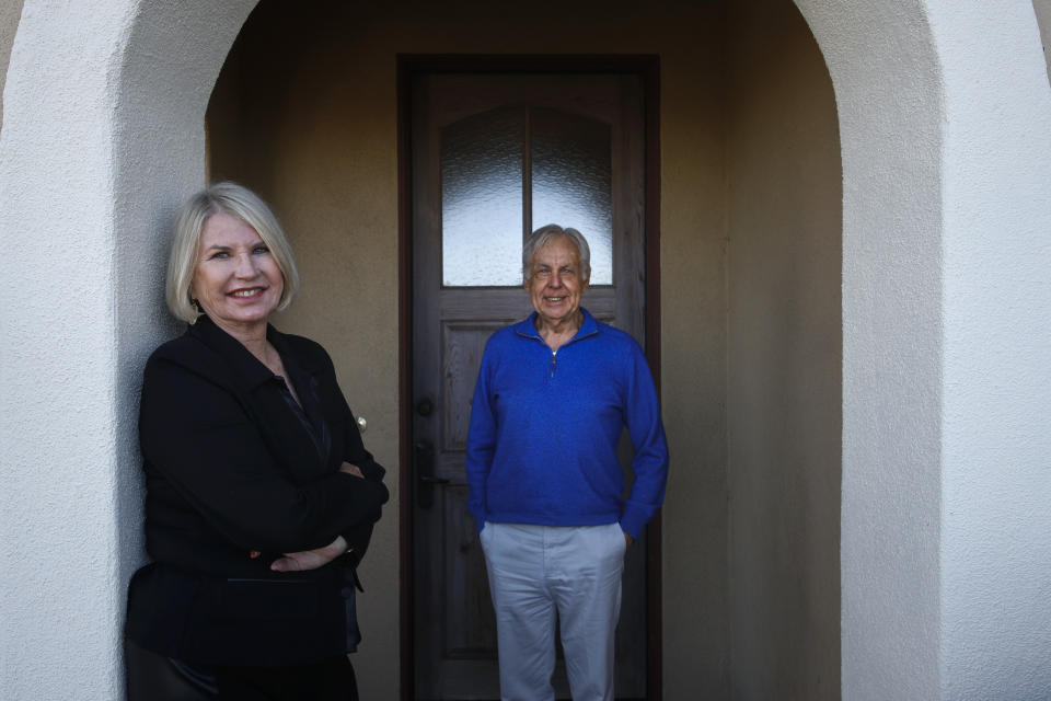 In this Feb. 6, 2019, photo Debbie Douglas, left, and her husband and business partner, Gary, pose for a photo in Newport Beach, Calif. In business together for 16 years, the Douglases have found that being co-owners of a public relations firm requires them to be more direct with each other than they once were as spouses. (AP Photo/Jae C. Hong)