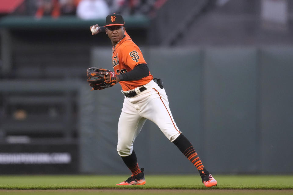 San Francisco Giants shortstop Marco Luciano throws out Boston Red Sox's Rafael Devers at first base during the fourth inning of a baseball game in San Francisco, Friday, July 28, 2023. (AP Photo/Jeff Chiu)