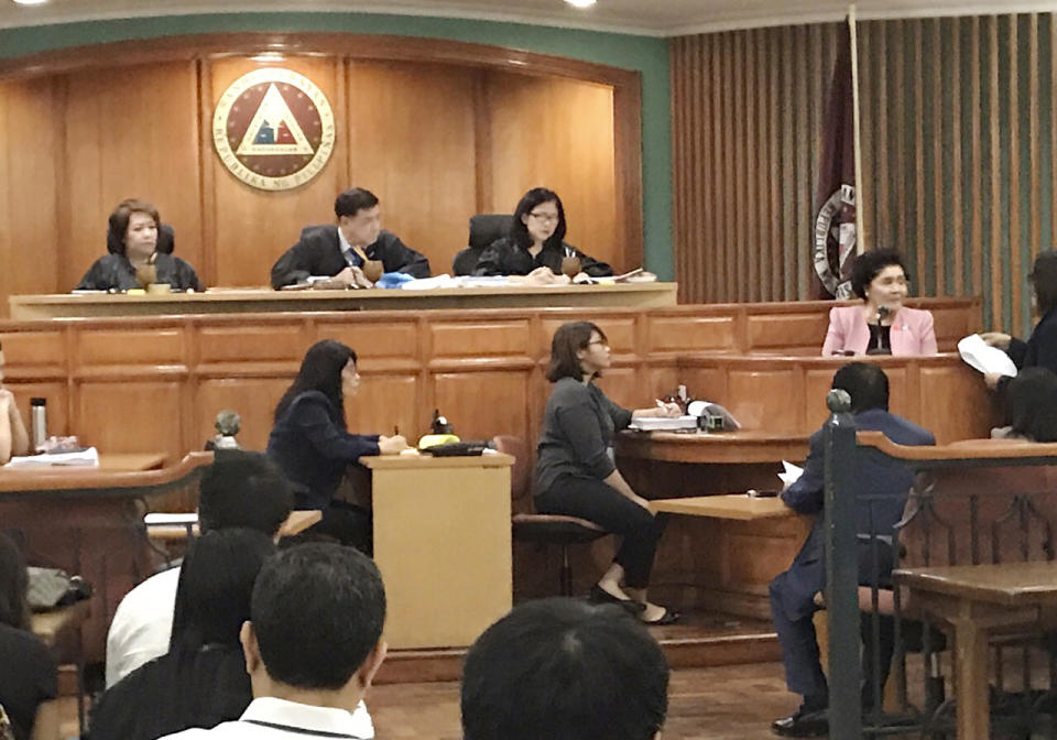 Former Philippine First Lady Imelda Marcos, extreme right, takes the witness stand to explain her side for not attending last week's promulgation of the graft charges against her Friday, Nov. 16, 2018 at an anti-graft court Sandiganbayan in suburban Quezon city northeast of Manila, Philippines. A Philippine court found Imelda Marcos guilty of graft and ordered her arrest last week in a rare conviction among many corruption cases that she's likely to appeal to avoid jail and losing her seat in Congress. (AP Photo/Joeal Calupitan)