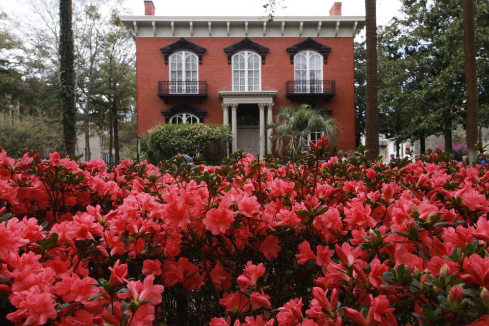 Monterey Square is full of color in front of the historic Mercer-Williams House.